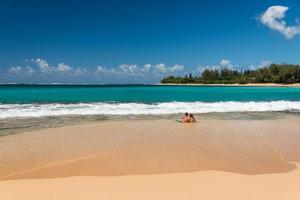 HONOLULU, USA - AUGUST, 14 2014 - People having fun at hawaii beach photo