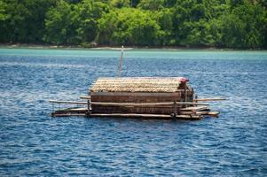 Small wood floating fishing platform in sulawesi indonesia photo