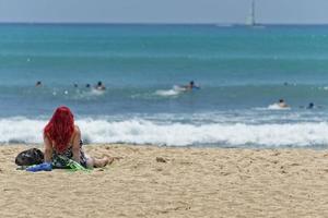 HONOLULU, USA - People having fun at waikiki beach photo