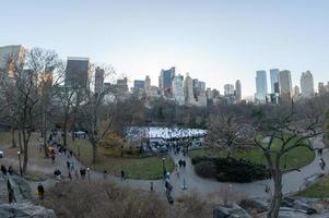 NEW YORK, USA - DECEMBER 11, 2011 - People skating in Central Park crowded of people for xmas photo