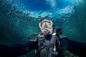 Scuba diver underwater selfie portrait in the ocean photo