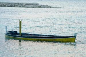 abandoned submerged woooden boat photo