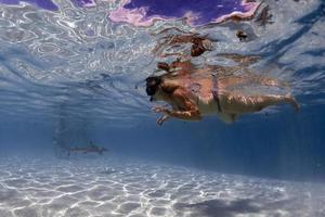 snorkeling in french polynesia with stingray photo