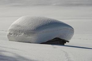 A wood cabin hut in the winter snow background photo