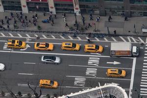 NEW YORK, USA - APRIL 21, 2017 - People and yellow taxi cab photo