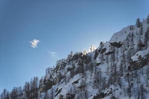 mountain in winter at sunset photo