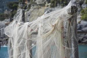 Fishing net hanging for drying photo