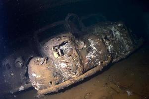 Old Car inside II world war ship wreck hold photo