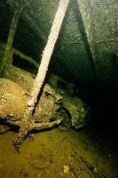 Old Car inside II world war ship wreck hold photo