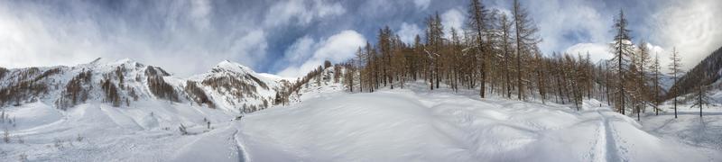 High mountain snow path in winter time sunny view photo