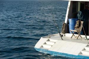 fishing rod on boat ship in maldives photo