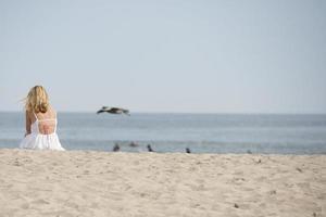 woman relaxing in malibu beach photo