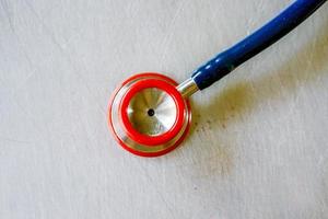 Closeup and crop Small stethoscope on aluminum board. photo