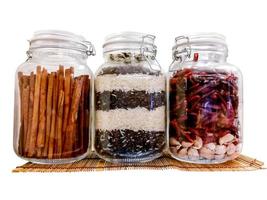 food raw material in glass jar on isolate white background. photo