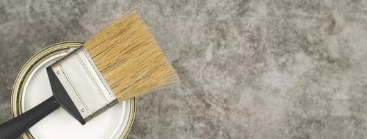 Paint brush on pink background, how to choose the perfect home paint color and good for health photo