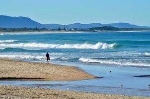 A walk on the beach on a sunny day photo