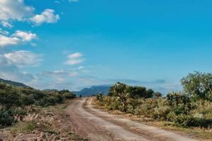 Dirt road with beautiful landscape towards the horizon photo