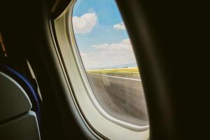 Airplane window view with landscape outside and copyspace photo