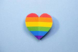 Heart with gay lgbt colors on blue background photo