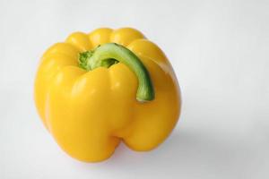 Bell yellow pepper with white background photo