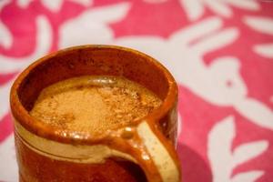 Mexican pitcher with traditional hot chocolate with copyspace photo