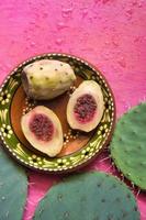 Mexican xoconostles texture with pink background photo