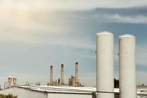 smoke towers in industrial area photo