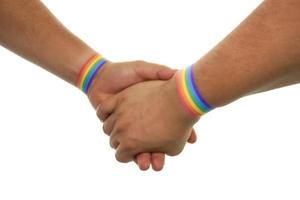dos manos juntas celebrando el orgullo gay foto