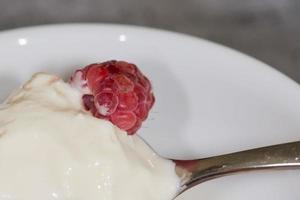 Red raspberry and strawberry on ice cream photo