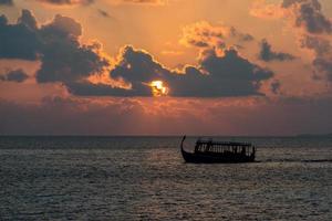 golden sunset in maldives with donhi photo