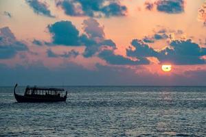 golden sunset in maldives with donhi photo