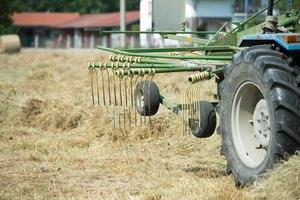 Tractor while harvesting mature wheat photo