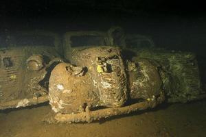 Old Car inside II world war ship wreck hold photo