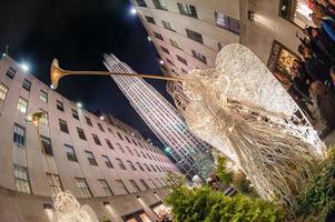 NEW YORK, USA - DECEMBER 9, 2011 - People at rockfeller center celebrating xmas photo