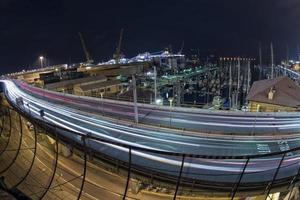 Car light tracks on Genoa Flyover at night photo