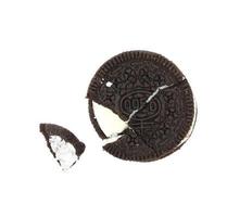 Sandwich chocolate cookies with a sweet cream with crumbs isolated on white background photo