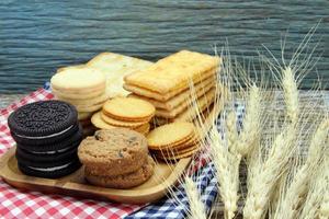variety of chocolate chip cookies on wooden table photo
