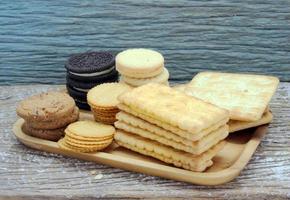 variety of chocolate chip cookies on wooden table photo