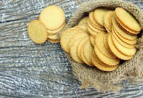 round cracker biscuits on sack bag photo