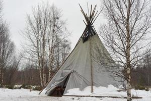 teepee in the snow background photo