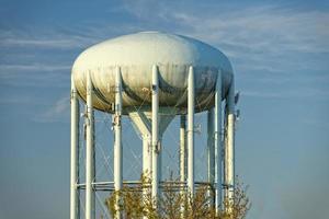 A water tower in the deep blue sky photo