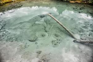 Natural hot pools in rocky mountains photo