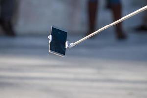 selfie control remoto en el teléfono celular foto