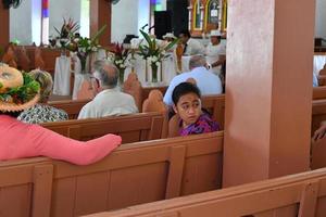 AITUTAKI, COOK ISLAND - AUGUST, 27 2017 - Local people at the mass photo