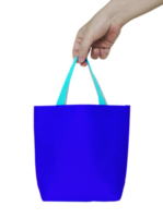 hand holding blue fabric bag isolated with clipping path for mockup png