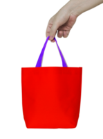 Hand, die eine rote Stofftasche hält, die mit Beschneidungspfad für Mockup isoliert ist png