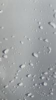 Water droplets perspective through white color surface good for multimedia content backgrounds photo