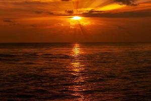 Beautiful sea landscape at sunset with orange sky