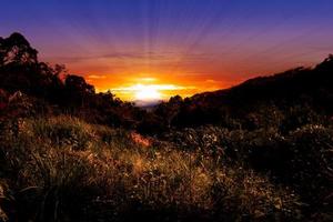 Beautiful sunrise landscape in mountain valley photo