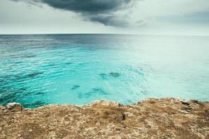 Seascape of the ocean by the rocky photo